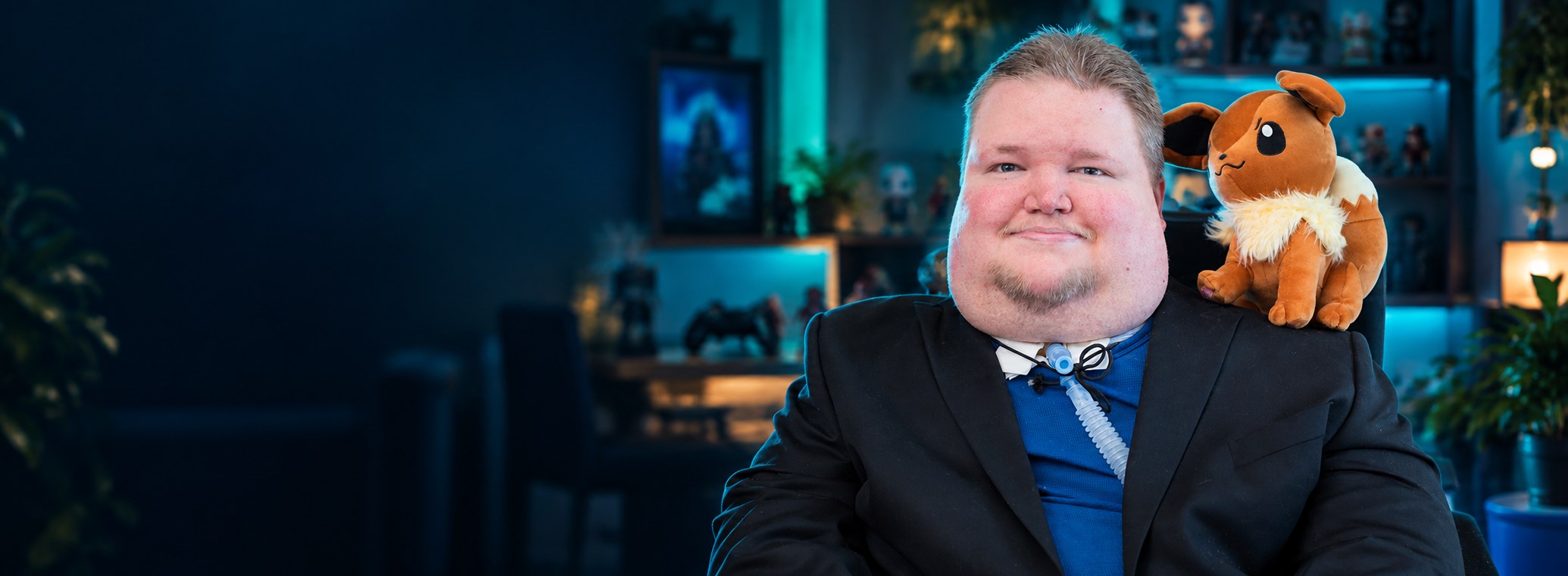 Steve Spohn in a teal-lit gaming studio; a stylized portrait based on his photograph.